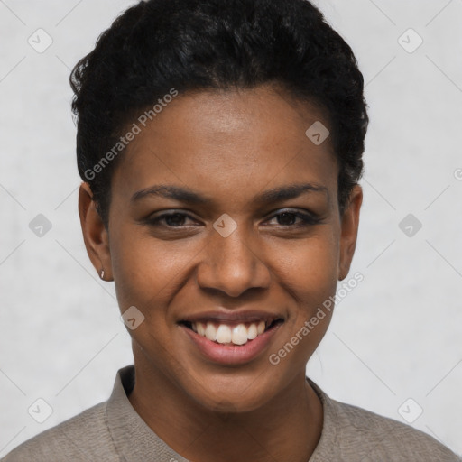 Joyful black young-adult female with short  black hair and brown eyes