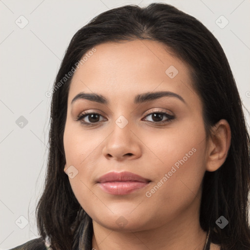 Joyful latino young-adult female with long  brown hair and brown eyes