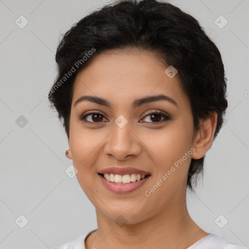 Joyful latino young-adult female with short  brown hair and brown eyes