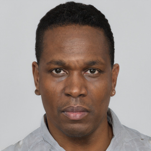 Neutral black young-adult male with short  black hair and brown eyes