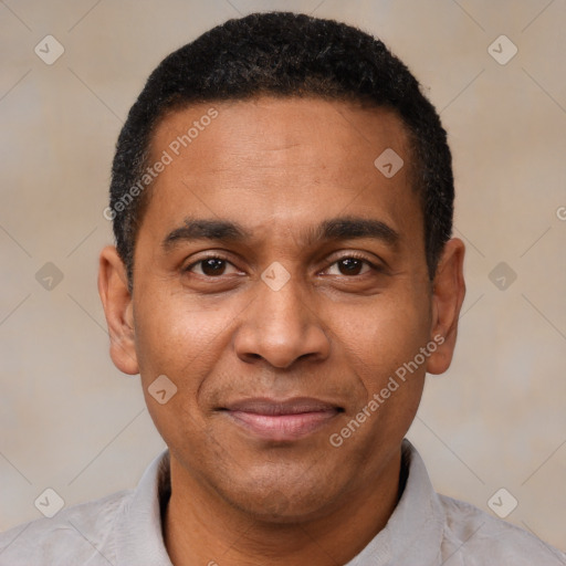 Joyful latino adult male with short  black hair and brown eyes