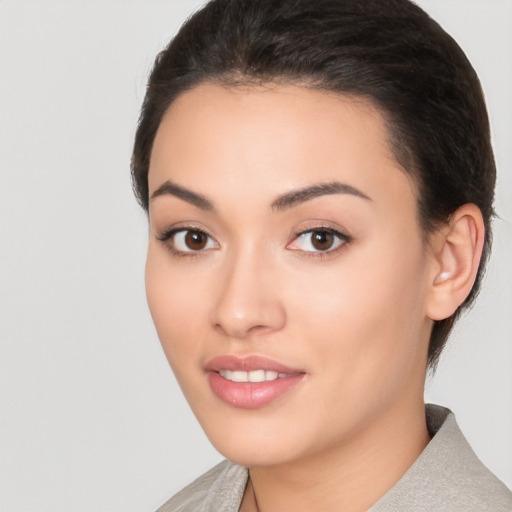 Joyful white young-adult female with short  black hair and brown eyes