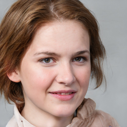 Joyful white young-adult female with medium  brown hair and blue eyes