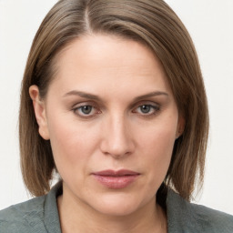 Neutral white young-adult female with medium  brown hair and grey eyes