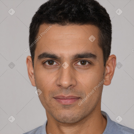 Joyful white young-adult male with short  black hair and brown eyes