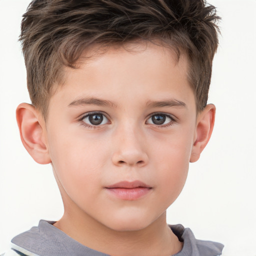 Joyful white child male with short  brown hair and brown eyes