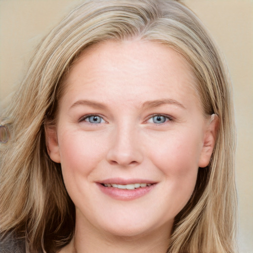 Joyful white young-adult female with long  brown hair and blue eyes