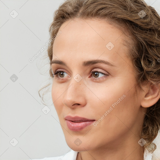 Joyful white young-adult female with medium  brown hair and green eyes