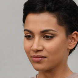 Joyful latino young-adult female with short  black hair and brown eyes