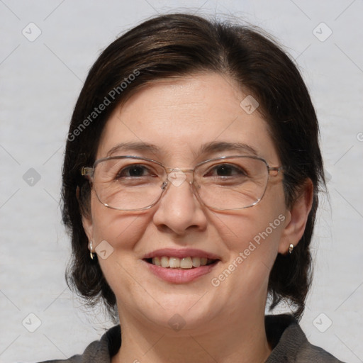 Joyful white adult female with medium  brown hair and brown eyes