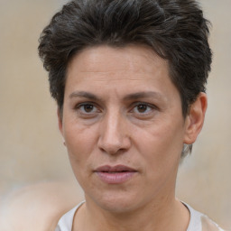 Joyful white adult female with short  brown hair and brown eyes