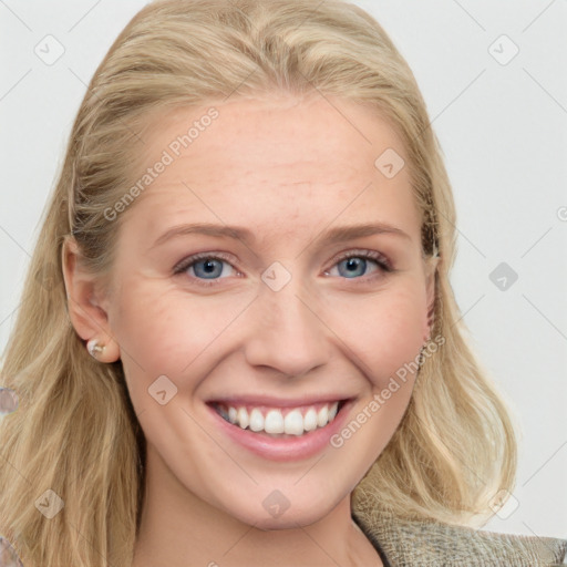 Joyful white young-adult female with long  brown hair and blue eyes