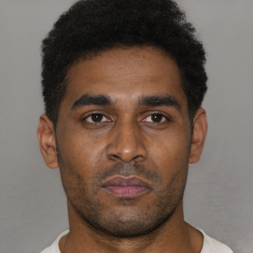 Neutral black young-adult male with short  black hair and brown eyes