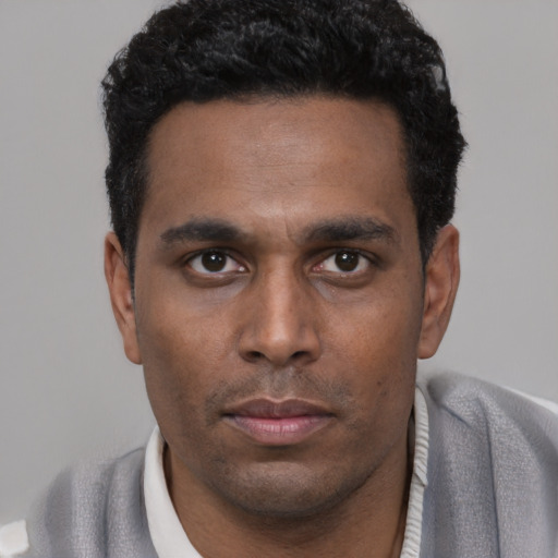 Neutral black young-adult male with short  black hair and brown eyes