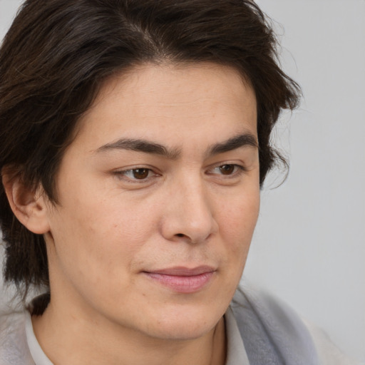 Joyful white adult female with short  brown hair and brown eyes