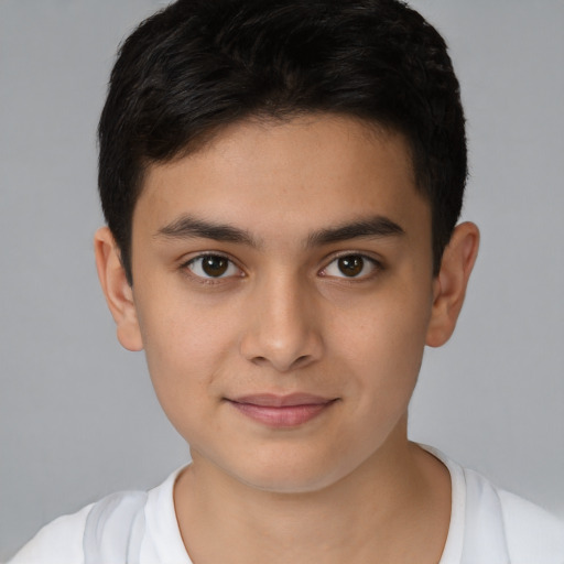 Joyful white child male with short  brown hair and brown eyes