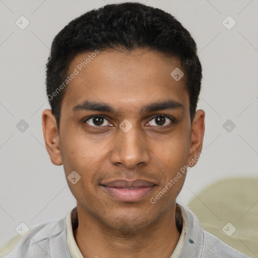 Joyful black young-adult male with short  black hair and brown eyes