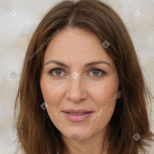 Joyful white adult female with long  brown hair and brown eyes