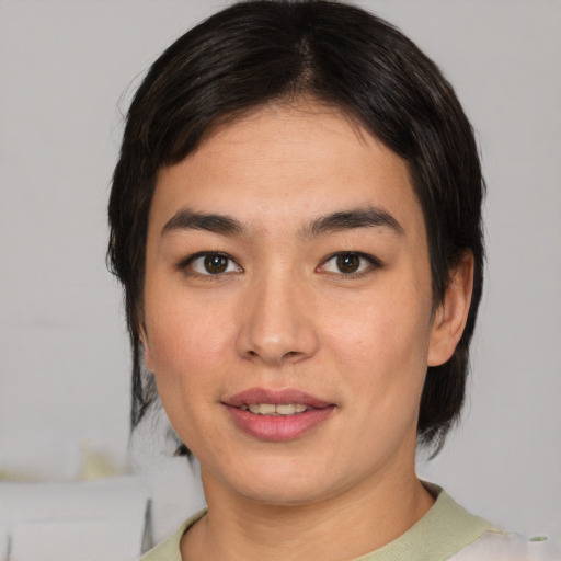 Joyful asian young-adult female with medium  black hair and brown eyes