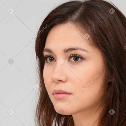 Neutral white young-adult female with long  brown hair and brown eyes