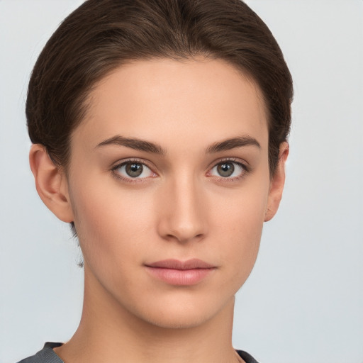 Neutral white young-adult female with short  brown hair and brown eyes