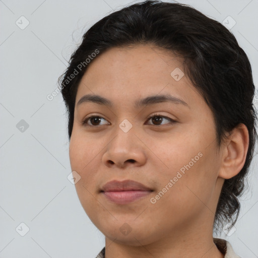 Joyful latino young-adult female with medium  brown hair and brown eyes