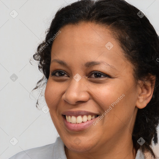 Joyful black young-adult female with medium  brown hair and brown eyes