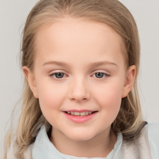 Joyful white child female with medium  brown hair and grey eyes