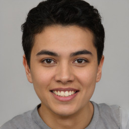 Joyful latino young-adult male with short  brown hair and brown eyes