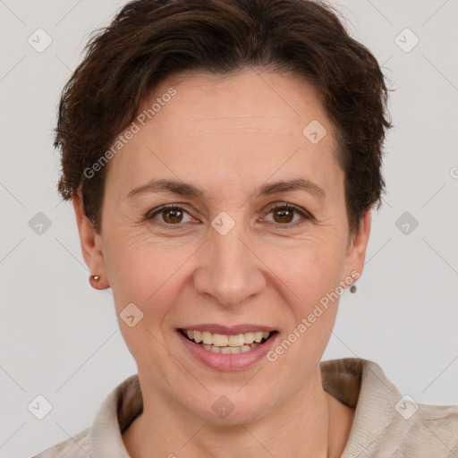 Joyful white adult female with short  brown hair and brown eyes