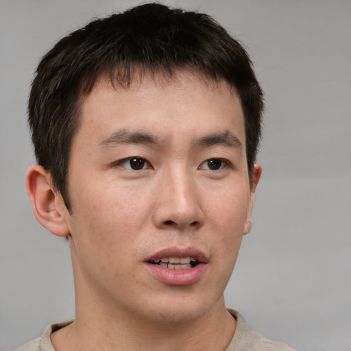 Neutral asian young-adult male with short  brown hair and brown eyes