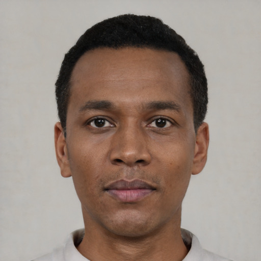 Neutral black young-adult male with short  black hair and brown eyes