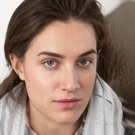 Neutral white young-adult female with medium  brown hair and grey eyes