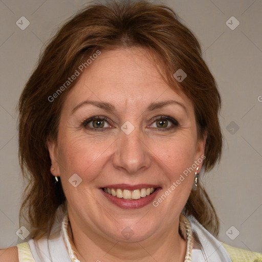 Joyful white adult female with medium  brown hair and blue eyes