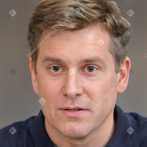 Joyful white adult male with short  brown hair and grey eyes