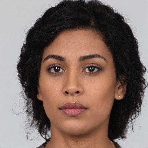 Neutral latino young-adult female with long  brown hair and brown eyes