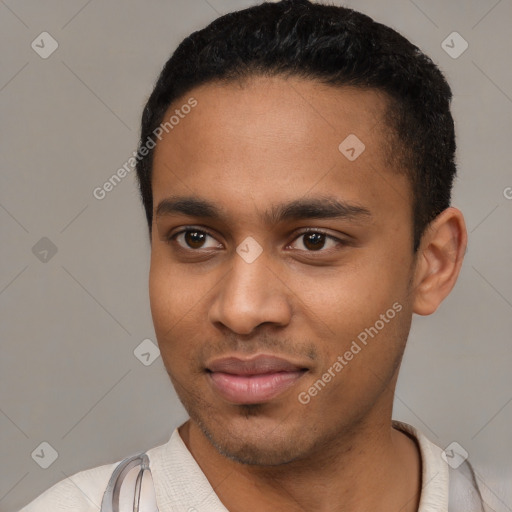 Joyful latino young-adult male with short  black hair and brown eyes