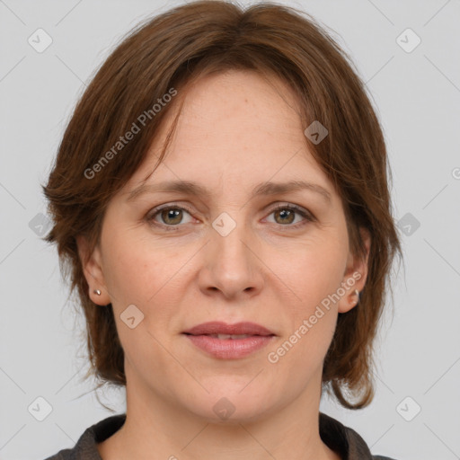 Joyful white adult female with medium  brown hair and grey eyes