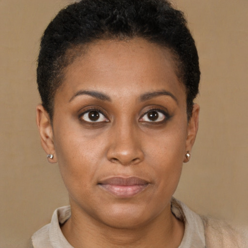 Joyful latino young-adult female with short  brown hair and brown eyes