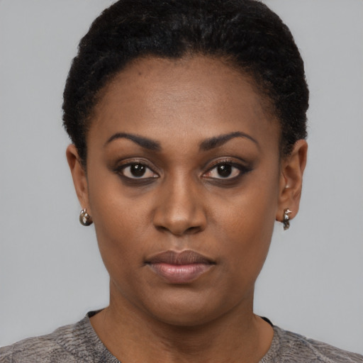Neutral black young-adult female with short  black hair and brown eyes