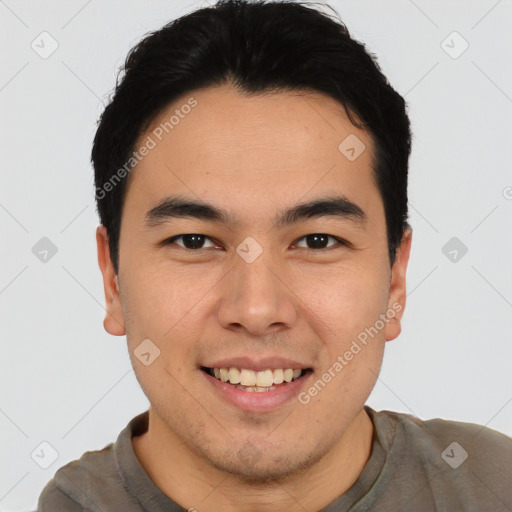 Joyful white young-adult male with short  black hair and brown eyes