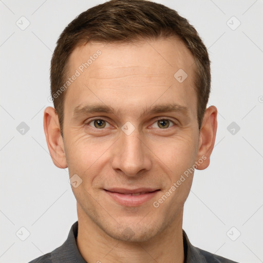 Joyful white adult male with short  brown hair and grey eyes