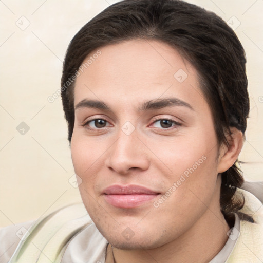 Joyful white young-adult female with short  brown hair and brown eyes