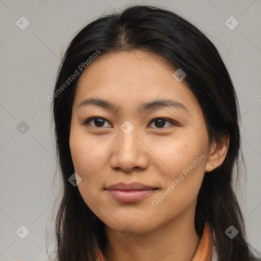 Joyful asian young-adult female with long  brown hair and brown eyes