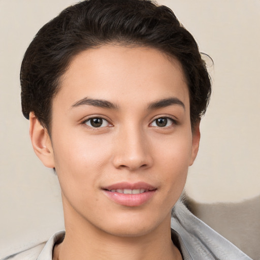 Joyful white young-adult female with short  brown hair and brown eyes