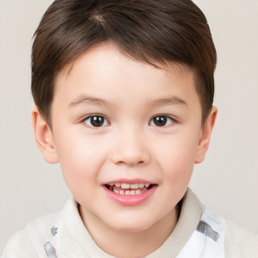 Joyful white child male with short  brown hair and brown eyes