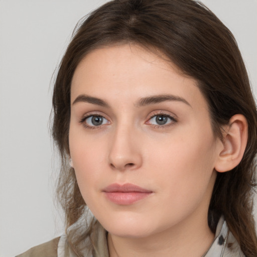 Neutral white young-adult female with medium  brown hair and grey eyes