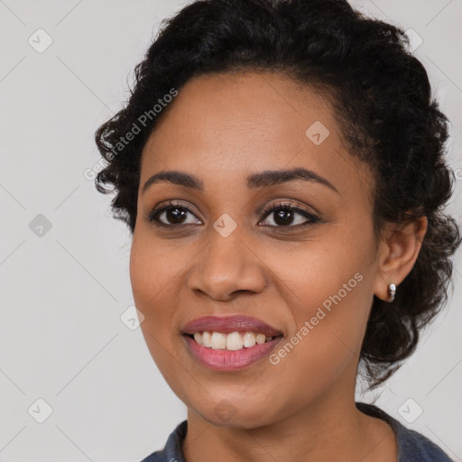 Joyful latino young-adult female with long  black hair and brown eyes