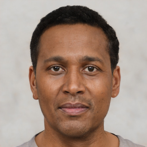 Neutral latino adult male with short  black hair and brown eyes