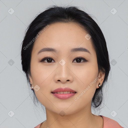 Joyful asian young-adult female with medium  black hair and brown eyes